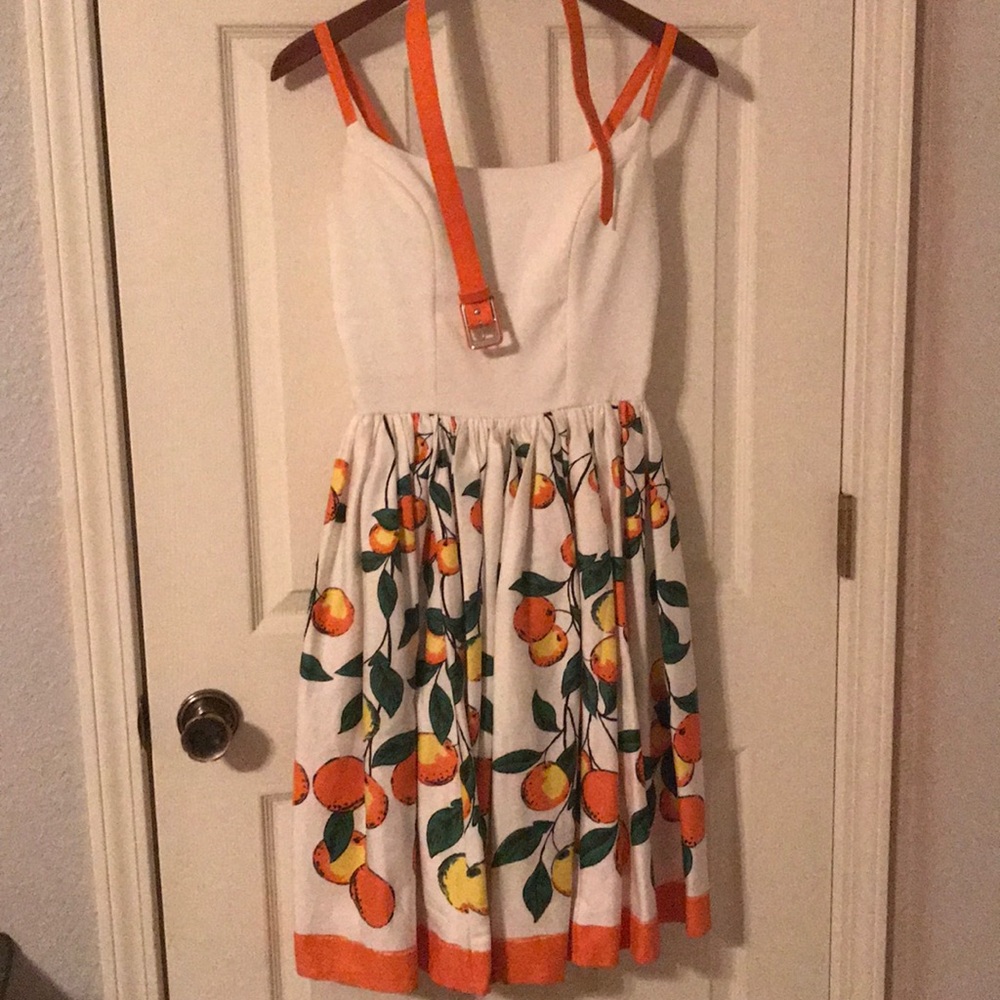 White cocktail dress with peach pattern